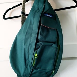 Evergreen Kavu Green Rope Sling Bag With Orange and Lime Green Interior